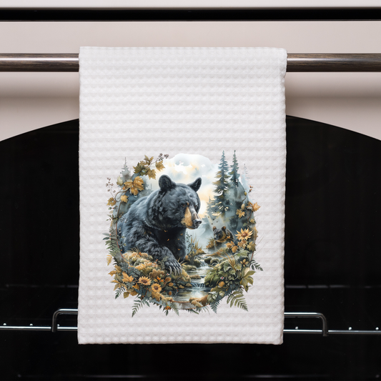 Bear by stream in forest